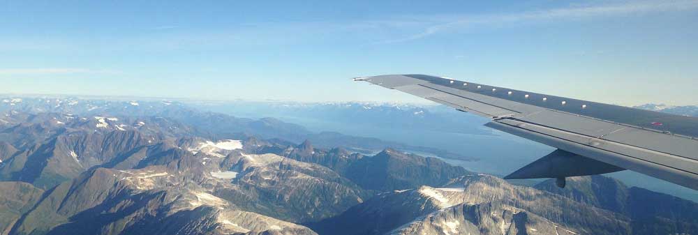 Airplane image over mountains